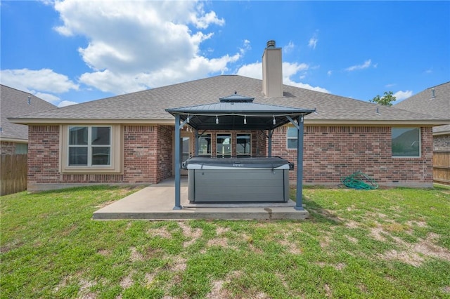 1208 Robinsville Ct, College Station, TX 77845 - back of house with a hot tub, a patio area, a gazebo, brick siding, and a chimney
