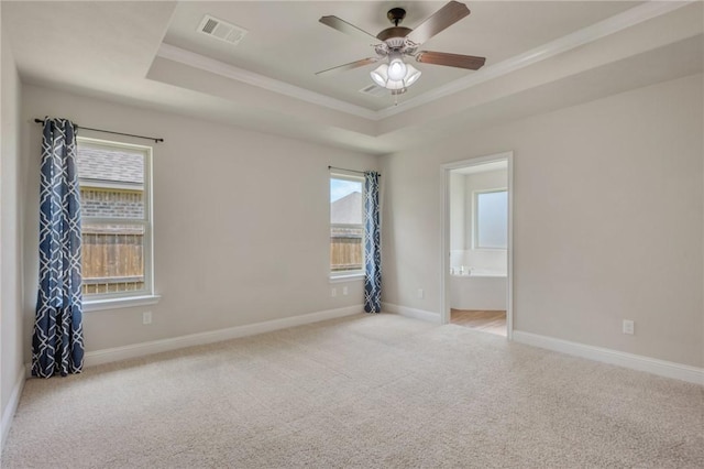 1208 Robinsville Ct, College Station, TX 77845 - unfurnished room with a raised ceiling, ornamental molding, carpet, a ceiling fan, and baseboards