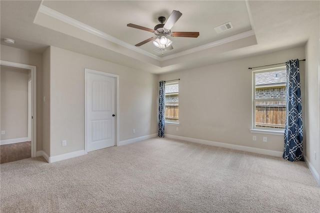1208 Robinsville Ct, College Station, TX 77845 - carpeted empty room featuring a tray ceiling, crown molding, ceiling fan, baseboards, and a smoke detector