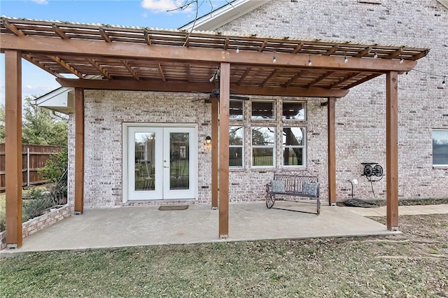 view of patio with french doors and a pergola