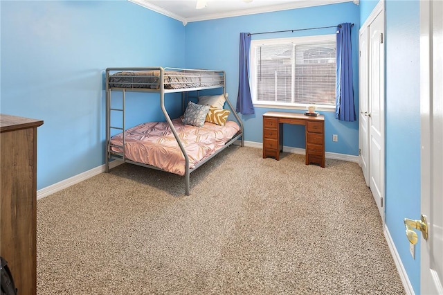 carpeted bedroom featuring crown molding