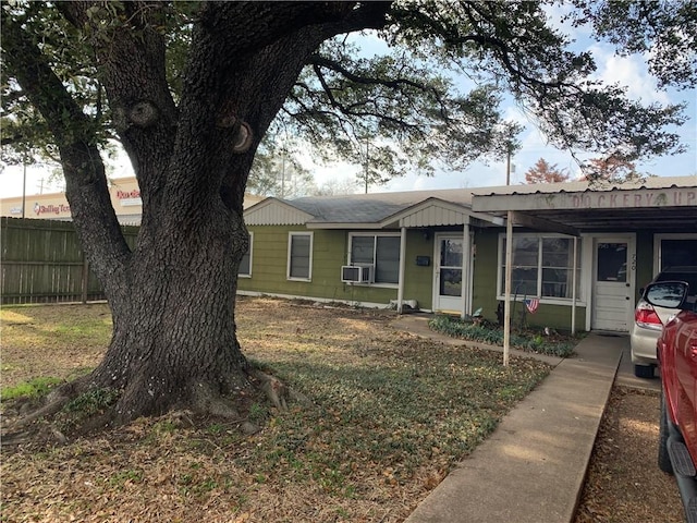 view of front of house featuring cooling unit and fence