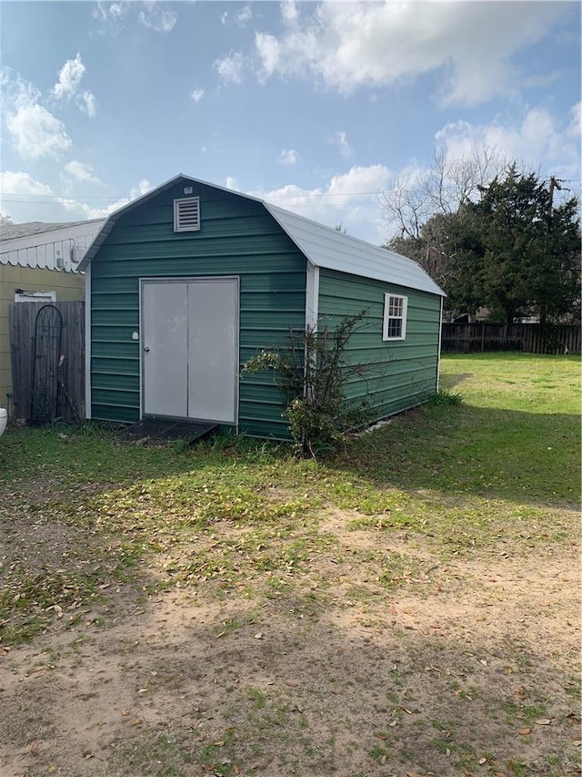 view of shed with fence