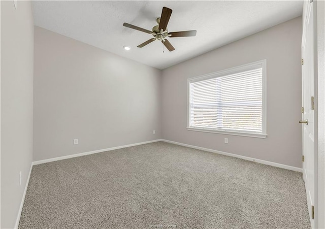 carpeted empty room with ceiling fan