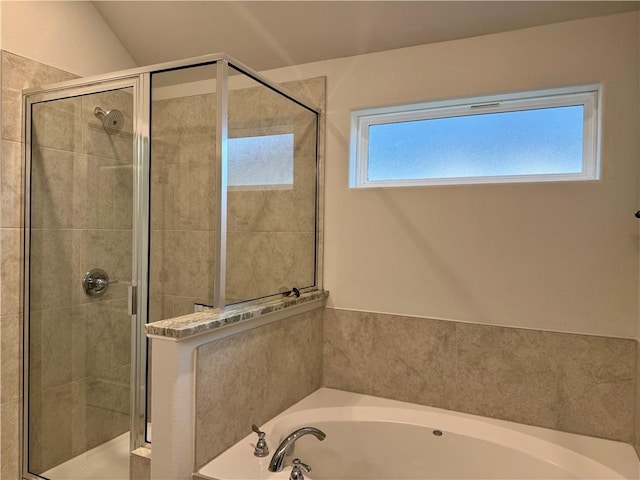 bathroom with lofted ceiling and independent shower and bath