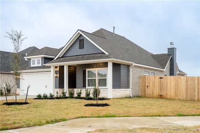 view of front facade featuring a garage and a front yard