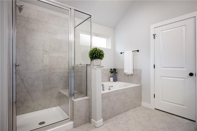 bathroom with lofted ceiling and separate shower and tub