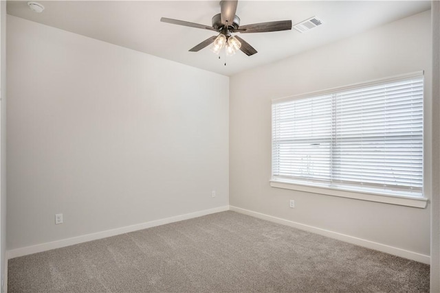 spare room with carpet flooring and ceiling fan