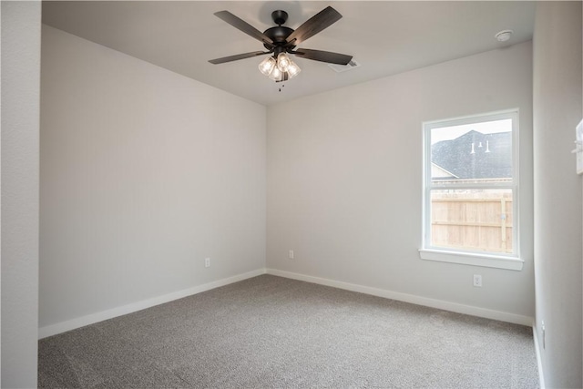 spare room with ceiling fan and carpet flooring