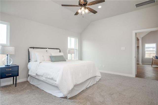 carpeted bedroom with lofted ceiling and ceiling fan