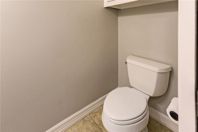 bathroom with tile patterned floors and toilet