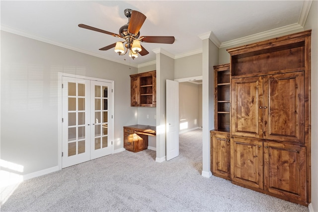 interior space with crown molding, french doors, ceiling fan, and light colored carpet