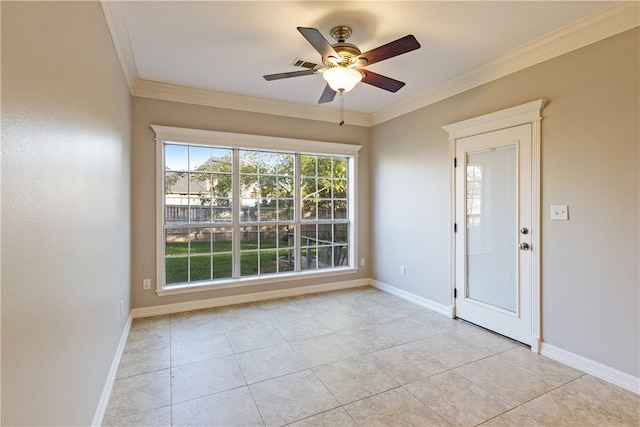 tiled empty room with ceiling fan and ornamental molding