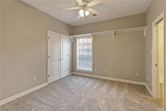 unfurnished bedroom with carpet flooring and ceiling fan