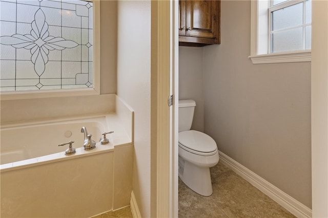 bathroom with a bath and toilet