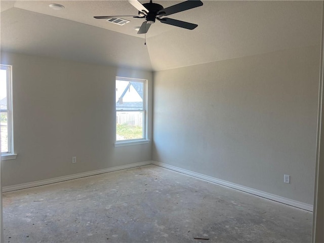 spare room featuring vaulted ceiling and ceiling fan