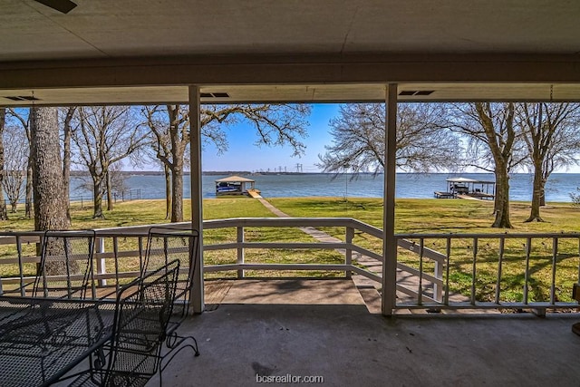 view of patio featuring a water view