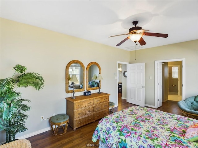 bedroom featuring ceiling fan, dark hardwood / wood-style floors, and connected bathroom