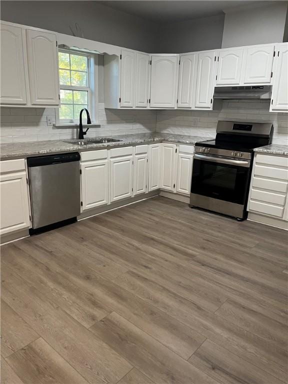 kitchen with white cabinets, stainless steel appliances, dark wood-type flooring, and sink