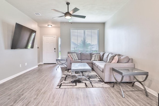 107 Meadow Lake Ct, Navasota, TX 77868 - living room featuring wood finished floors, baseboards, and ceiling fan