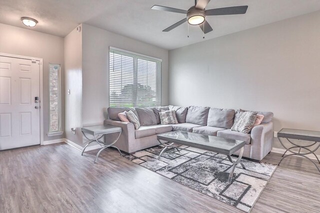 107 Meadow Lake Ct, Navasota, TX 77868 - living area featuring wood finished floors, ceiling fan, and baseboards