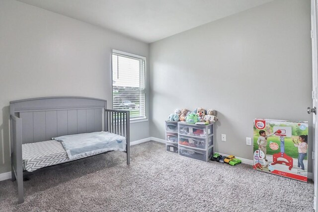 107 Meadow Lake Ct, Navasota, TX 77868 - bedroom with baseboards and carpet floors