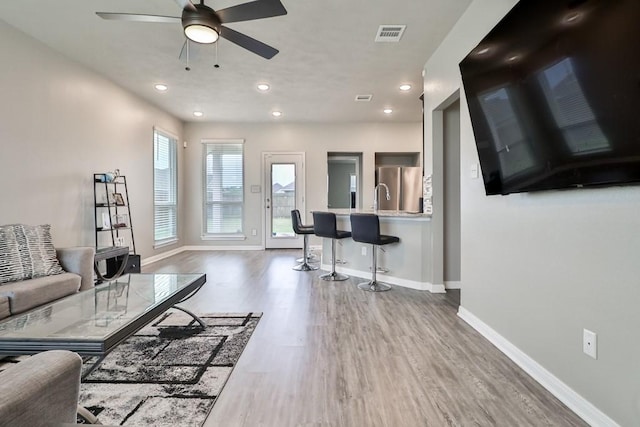 107 Meadow Lake Ct, Navasota, TX 77868 - living room with baseboards, wood finished floors, recessed lighting, and a ceiling fan