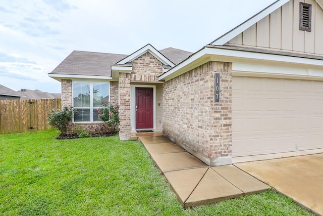 107 Meadow Lake Ct, Navasota, TX 77868 - view of front of home with board and batten siding, brick siding, a shingled roof, and a garage