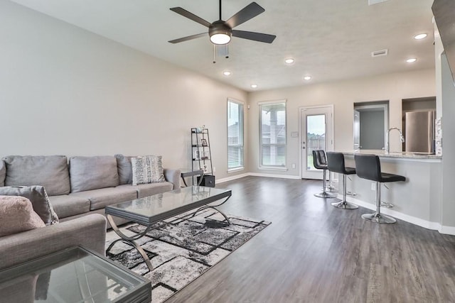 107 Meadow Lake Ct, Navasota, TX 77868 - living area with baseboards, dark wood-type flooring, a ceiling fan, and recessed lighting