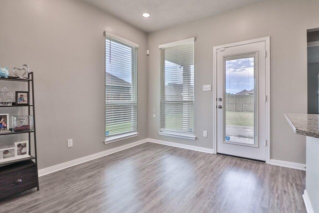 107 Meadow Lake Ct, Navasota, TX 77868 - doorway to outside with wood finished floors, baseboards, and recessed lighting