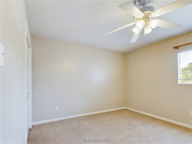 unfurnished room featuring ceiling fan and light colored carpet