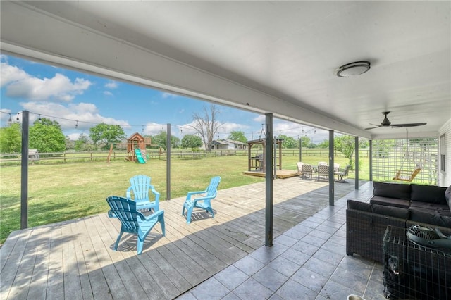 wooden deck featuring a yard, outdoor lounge area, and outdoor dining space
