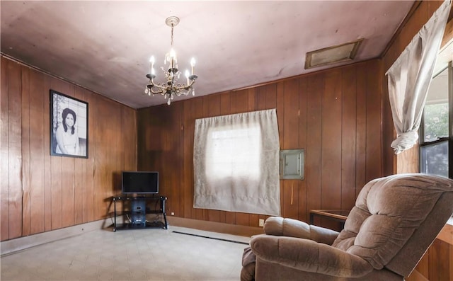 905 N Parker Ave, Bryan, TX 77803 - sitting room featuring wood walls and a chandelier