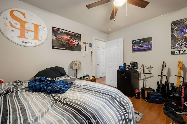 934 Dove Landing Ave, College Station, TX 77845 - bedroom with ceiling fan and wood finished floors