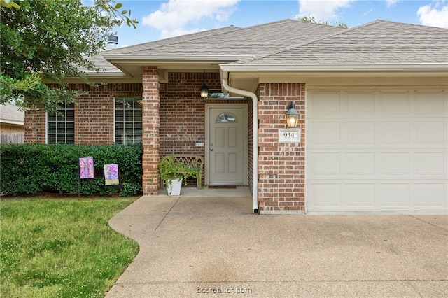 934 Dove Landing Ave, College Station, TX 77845 - entrance to property with brick siding, a shingled roof, and a garage