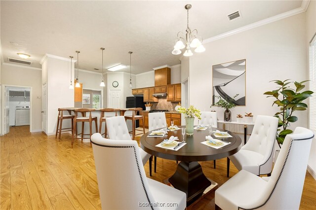 934 Dove Landing Ave, College Station, TX 77845 - dining room with washer / dryer, ornamental molding, and visible vents
