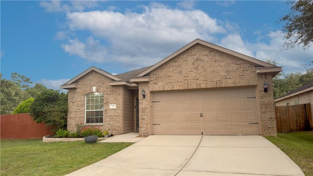 301 Pine Mist Ln, Conroe, TX 77304 - ranch-style home with brick siding, concrete driveway, and an attached garage
