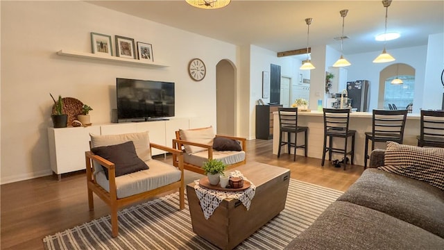 301 Pine Mist Ln, Conroe, TX 77304 - living room featuring arched walkways and wood finished floors