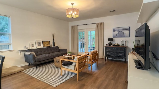 301 Pine Mist Ln, Conroe, TX 77304 - living area with wood finished floors and a chandelier