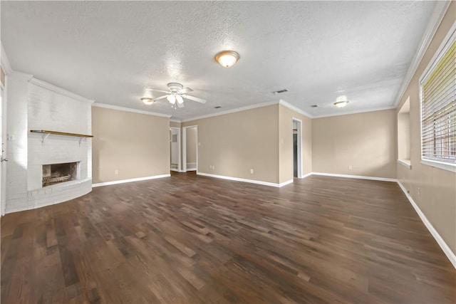 1503 Tara Ct, College Station, TX 77840 - unfurnished living room with ceiling fan, a textured ceiling, dark wood finished floors, a fireplace, and crown molding