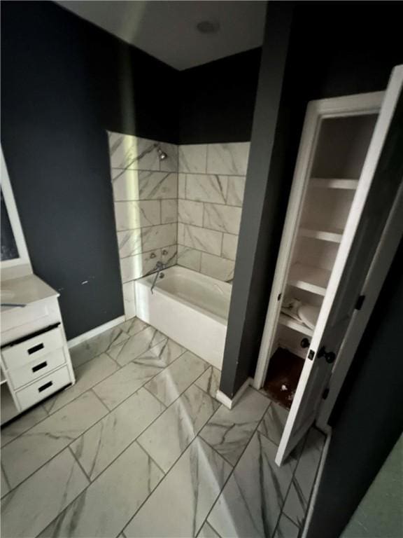 1113 W 10th St, Hearne, TX 77859 - full bath with marble finish floors, vanity, and shower / bathtub combination