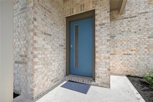 1121 Amistad Loop, College Station, TX 77845 - view of exterior entry featuring brick siding