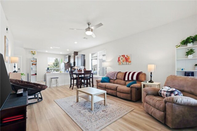 1121 Amistad Loop, College Station, TX 77845 - living area with ceiling fan, light wood-style floors, and recessed lighting