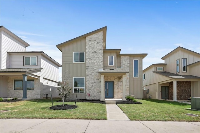 1121 Amistad Loop, College Station, TX 77845 - modern home with board and batten siding and a front yard
