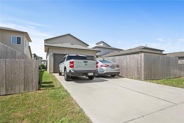 1121 Amistad Loop, College Station, TX 77845 - view of side of property with a garage and concrete driveway