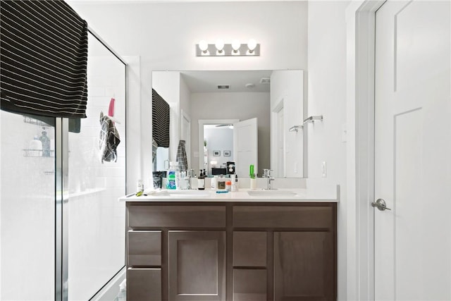 1121 Amistad Loop, College Station, TX 77845 - bathroom with double vanity and a shower stall