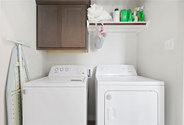 1121 Amistad Loop, College Station, TX 77845 - laundry area featuring washer and dryer and cabinet space