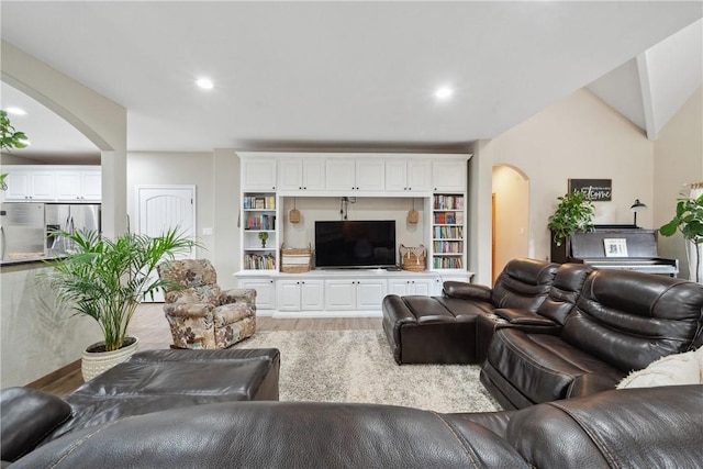 740 Bridget Ave, Buffalo, TX 75831 - living room with arched walkways, light wood-type flooring, and recessed lighting