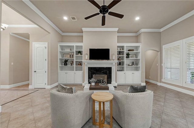 tiled living room with ceiling fan and ornamental molding