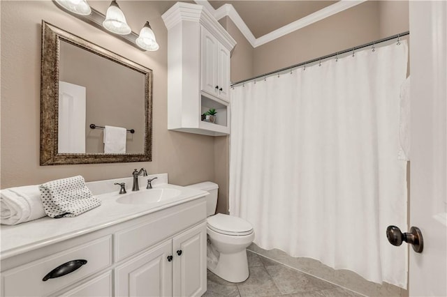 bathroom featuring tile patterned flooring, vanity, toilet, and crown molding